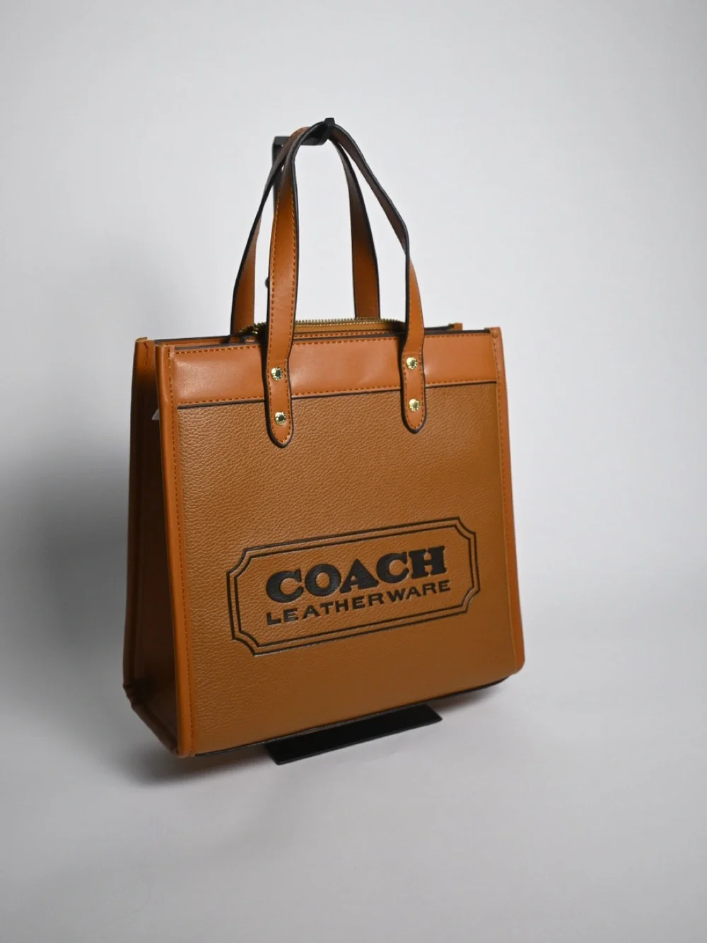 Coach Tan Pebbled Leather Logo Tote with Charm